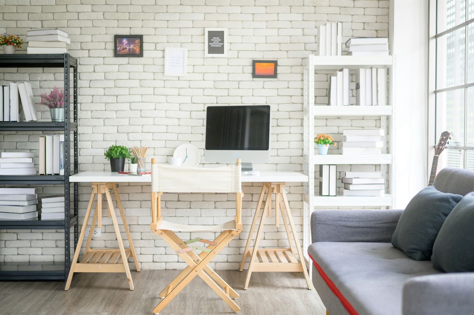 Organized home office with freestanding shelves, a simple desk, and framed wall art for renter-friendly storage without drilling. Organized home office with freestanding shelves, a simple desk, and framed wall art for renter-friendly storage without drilling.