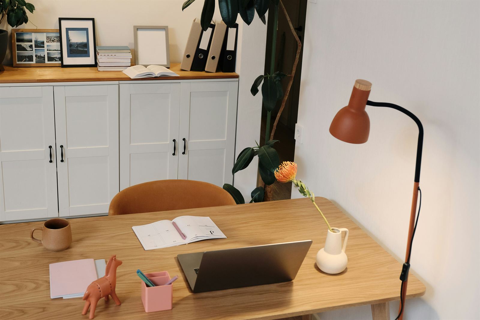 Organized home office with a clutter-free desk, practical storage, and workspace essentials for a productive home office. Organized home office with a clutter-free desk, practical storage, and workspace essentials for a productive home office.
